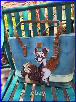 NWT 2022 Disney Parks dooney bourke Lady & The Tramp Tote Bag in hand